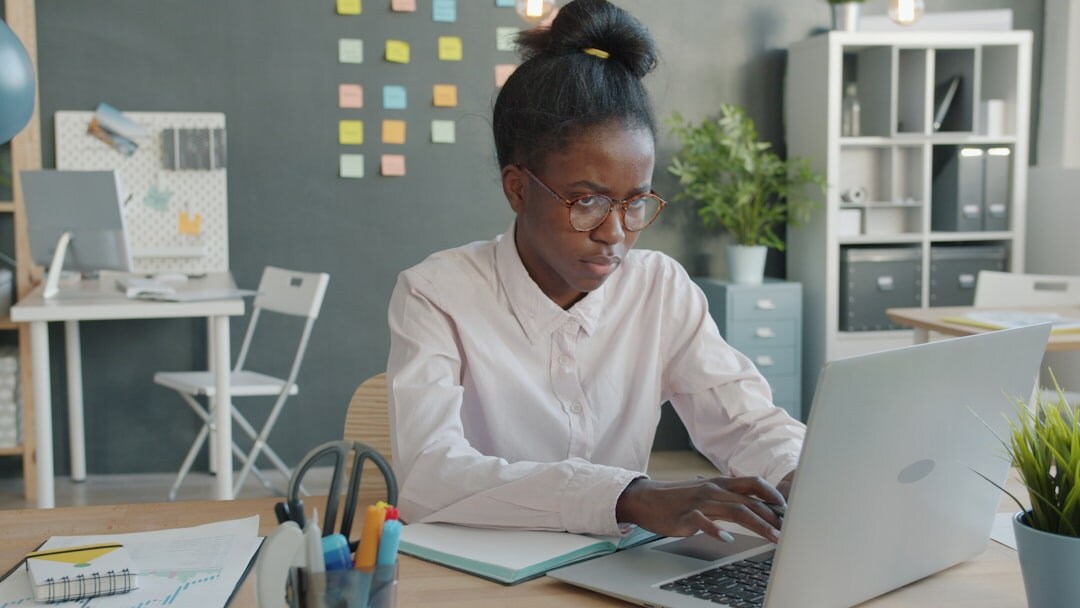 african founder working on laptop