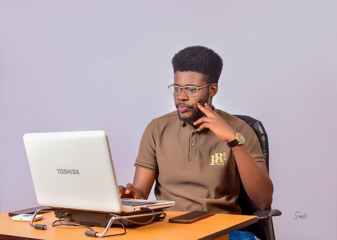 african entrepreneur working on laptop