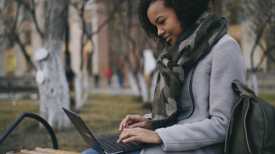 african woman using laptop