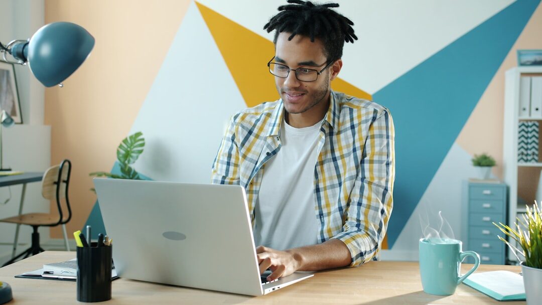 african entrepreneur working on laptop